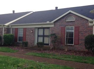 1018 General George Patton Road, Unit 1018 Nashville, TN 37221 - Photo 2 of 8 a front view of a house with garden