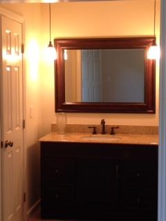 1018 General George Patton Road, Unit 1018 Nashville, TN 37221 - Photo 6 of 8 a bathroom with a sink and a mirror