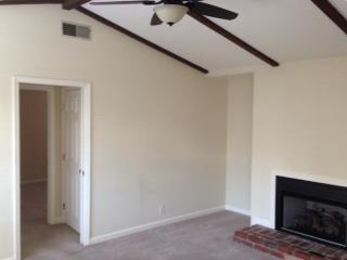 1018 General George Patton Road, Unit 1018 Nashville, TN 37221 - Photo 7 of 8 a view of an empty room with wooden floor and a fireplace