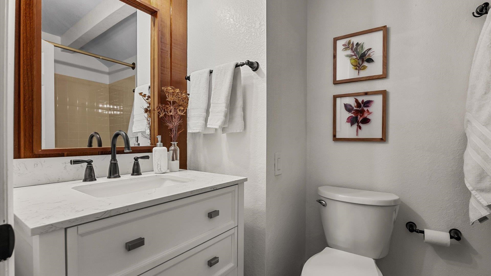 397 Ridge Cir Drive, Unit 3 Grand Junction, CO 81507 - Photo 24 of 28 a bathroom with a toilet sink and mirror