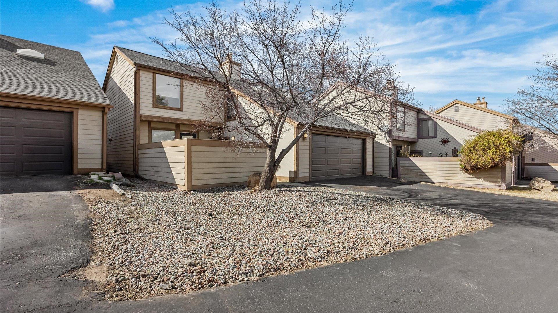 397 Ridge Cir Drive, Unit 3 Grand Junction, CO 81507 - Photo 3 of 28 a front view of a house with a yard