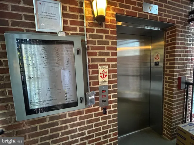 a view of front door with wooden door