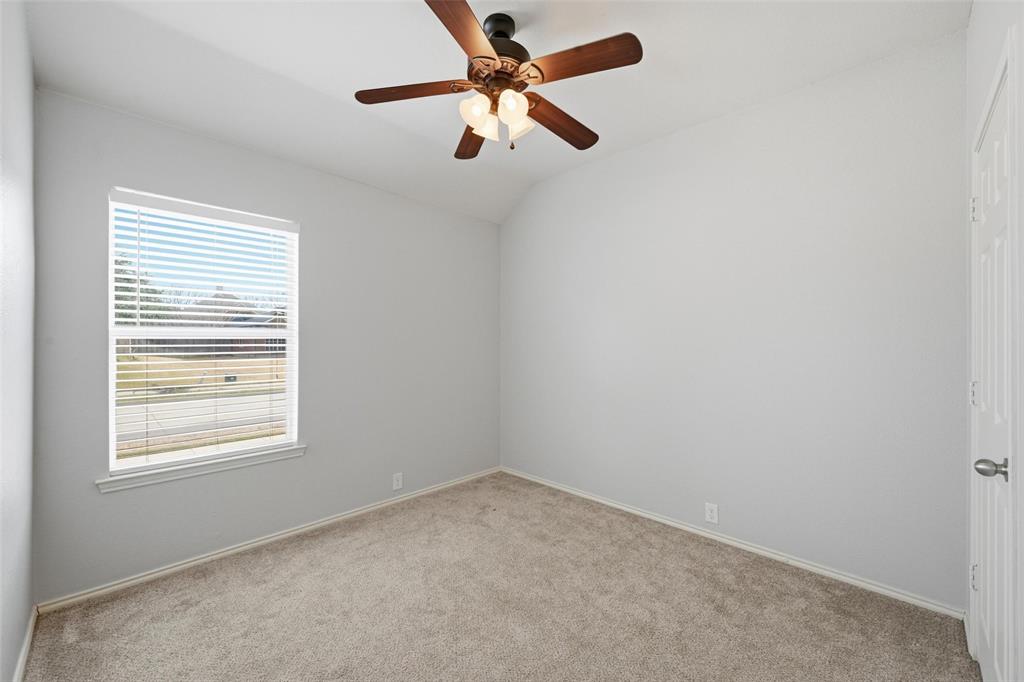 1020 Hay Stack Court Little Elm, TX 75068 - Photo 11 of 20 an empty room with a window and a fan