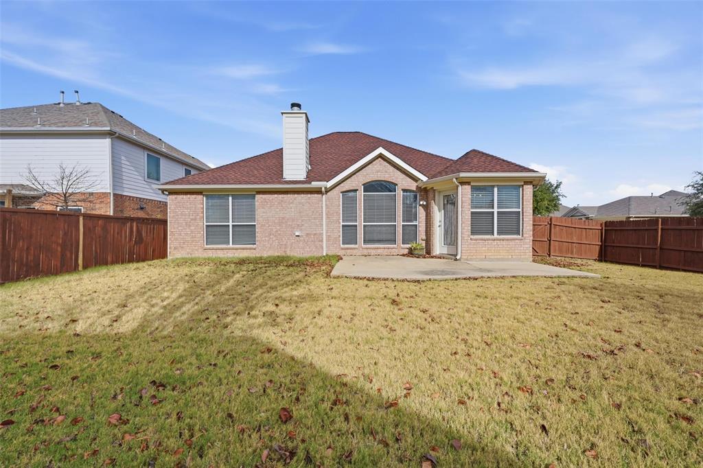 1020 Hay Stack Court Little Elm, TX 75068 - Photo 19 of 20 a front view of a house with a yard