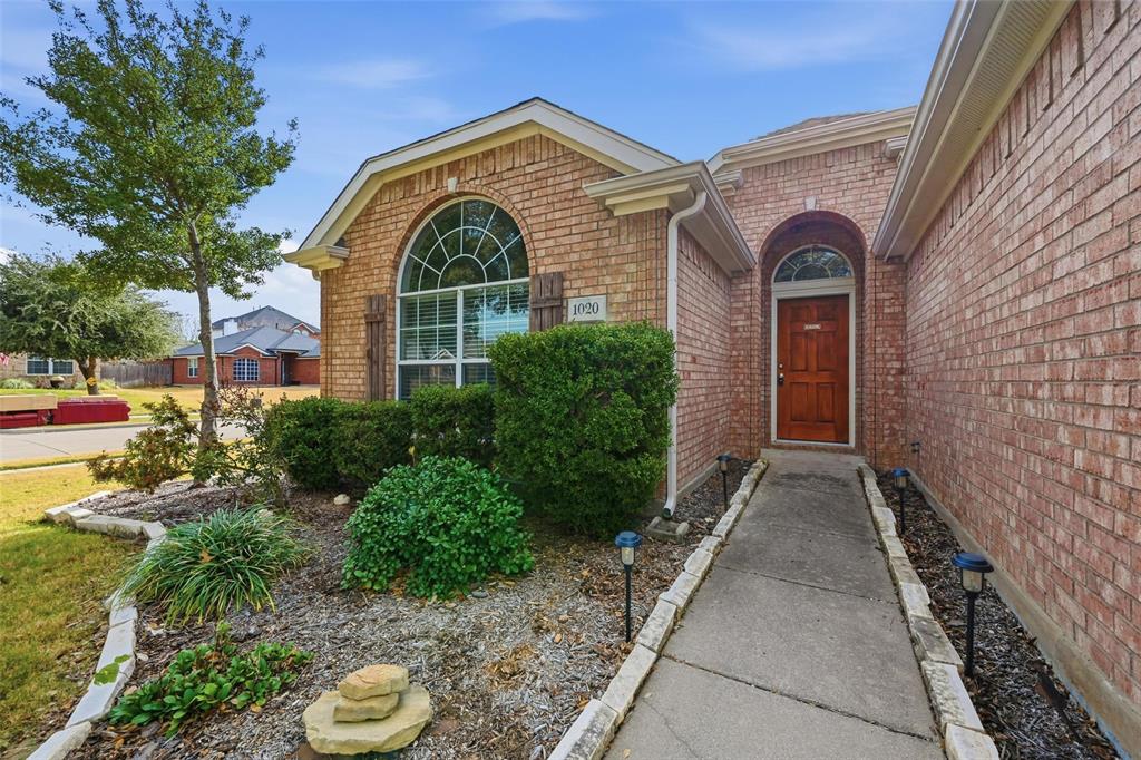 1020 Hay Stack Court Little Elm, TX 75068 - Photo 20 of 20 a front view of a house with garden