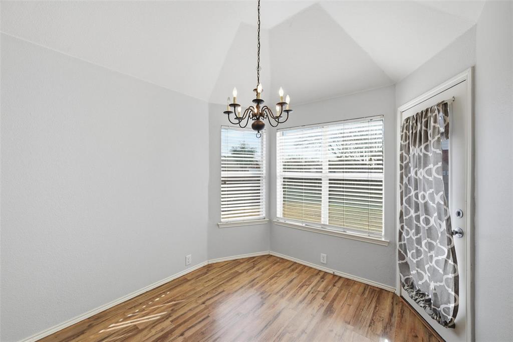 1020 Hay Stack Court Little Elm, TX 75068 - Photo 9 of 20 a view of a livingroom with a window and a chandelier