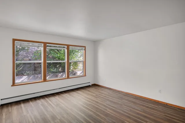 a view of a kitchen cabinets and a wooden floor