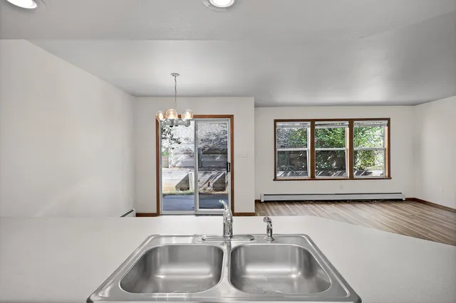a stove top oven sitting inside of a kitchen