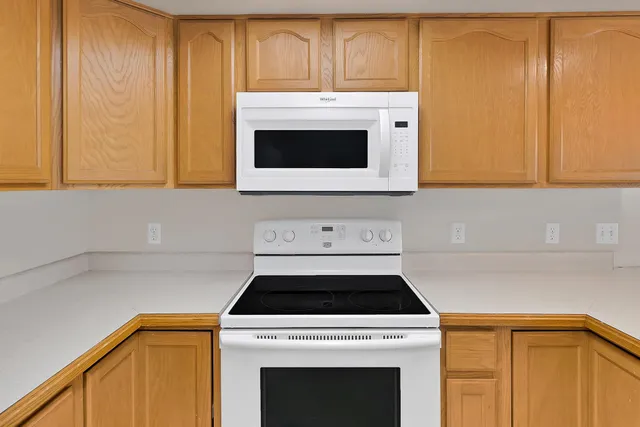 a white refrigerator freezer sitting in a kitchen