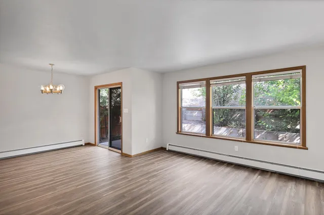 a view of a kitchen with wooden floor
