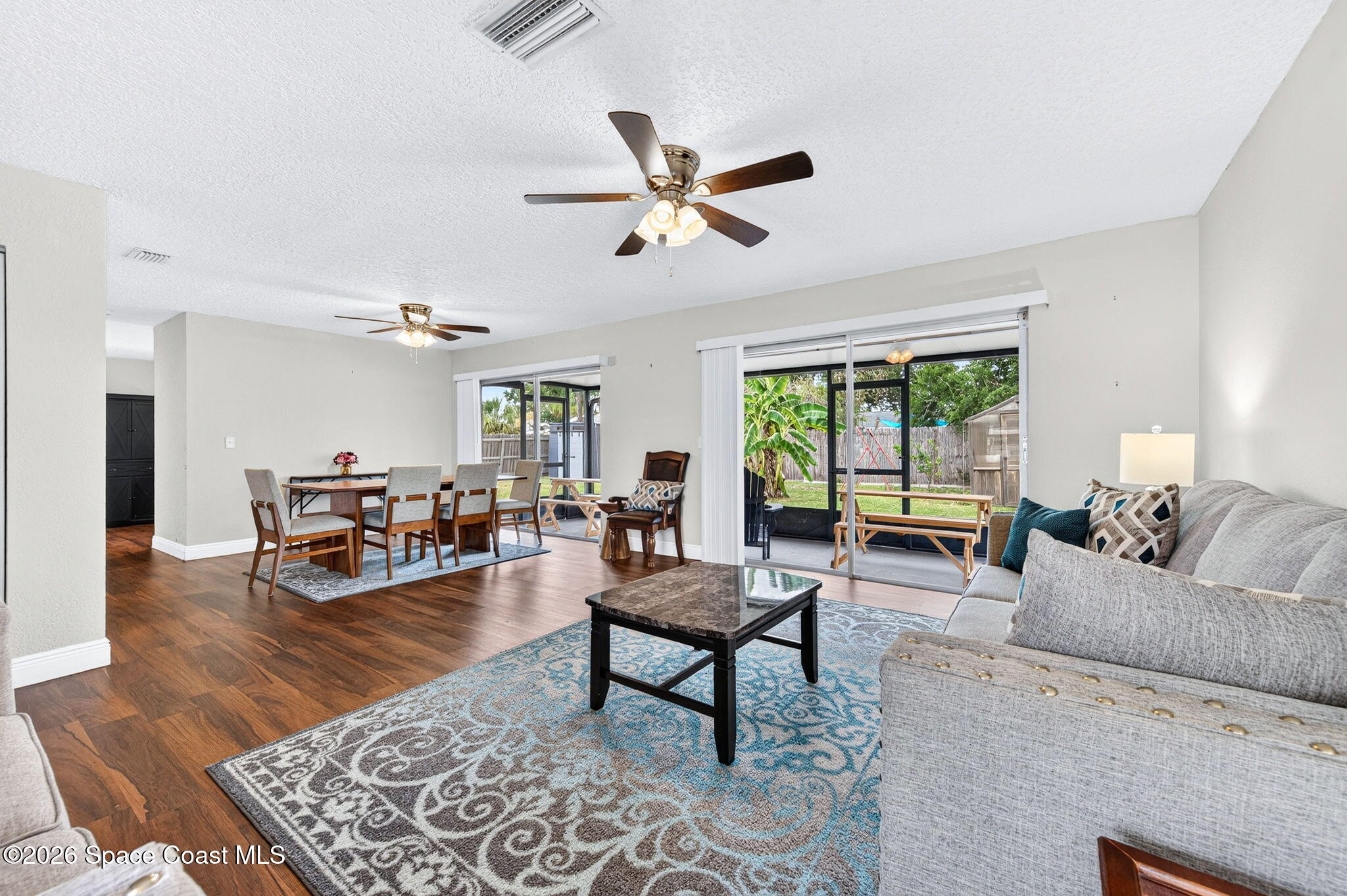 996 Botany Lane Rockledge, FL 32955 - Photo 8 of 35 a living room with furniture and a large window