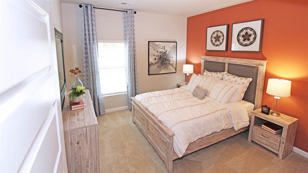 328 Bullock Pass Jefferson, GA 30549 - Photo 12 of 23 a bedroom with a bed and a lamp with the outer view