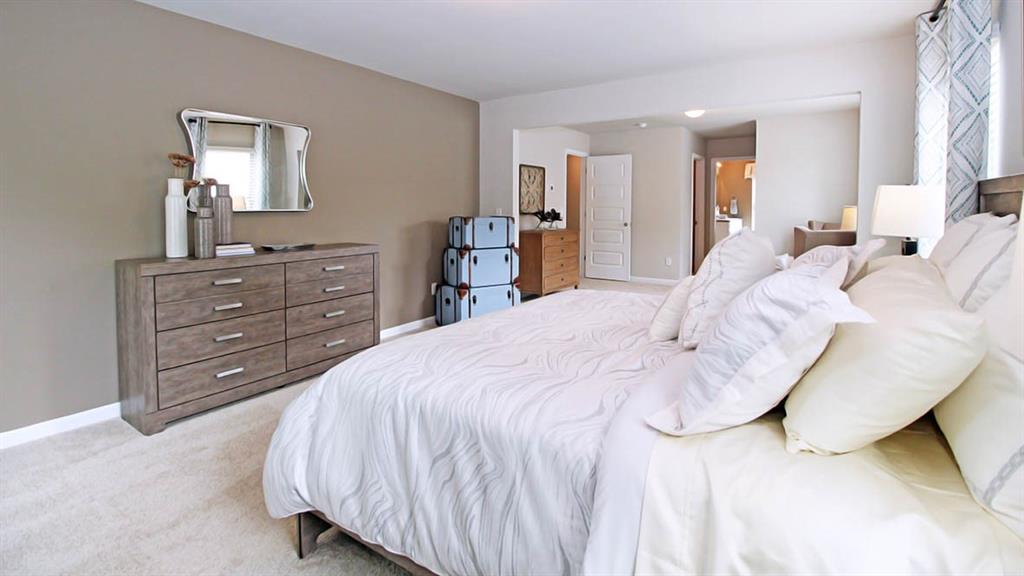 328 Bullock Pass Jefferson, GA 30549 - Photo 17 of 23 a bed room with a bed and a mirror