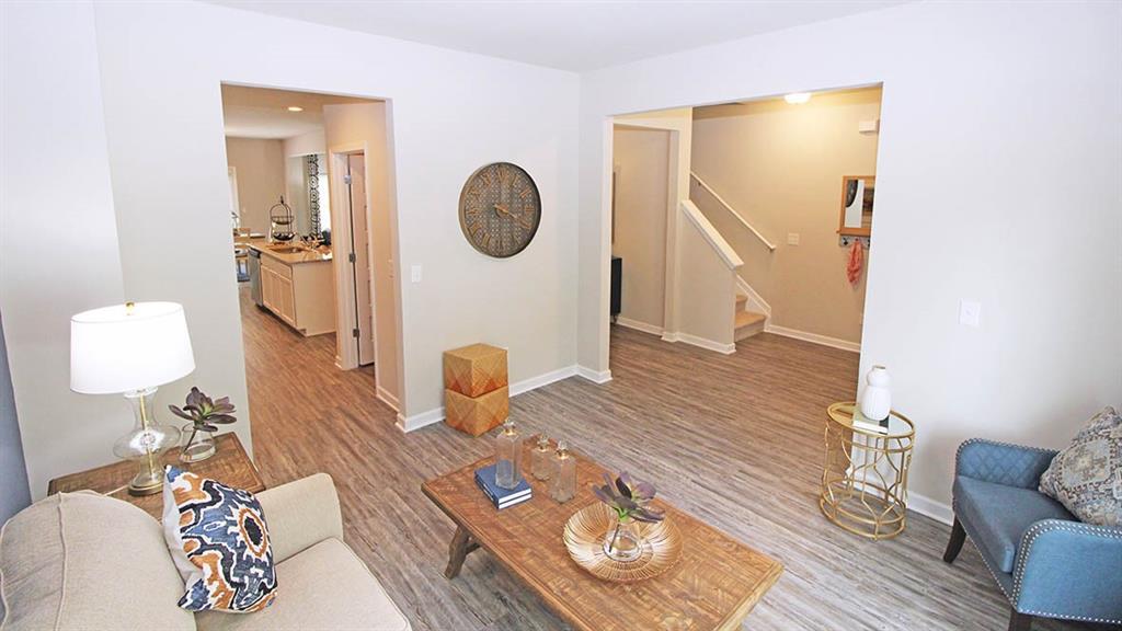 328 Bullock Pass Jefferson, GA 30549 - Photo 9 of 23 a living room with furniture and a mirror