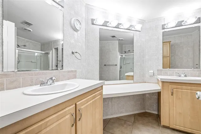 a bathroom with a sink a vanity and a mirror