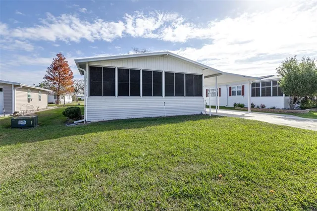 a front view of a house with a yard table and chairs