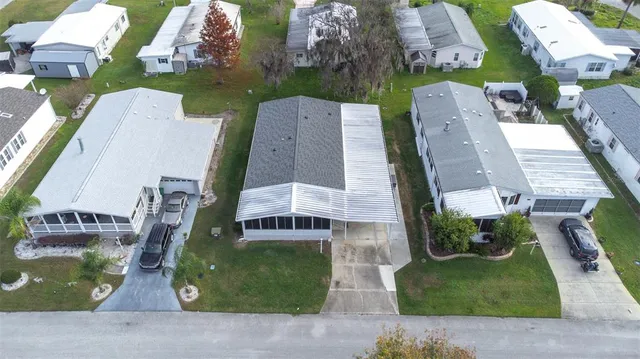 an aerial view of a house with a garden and plants