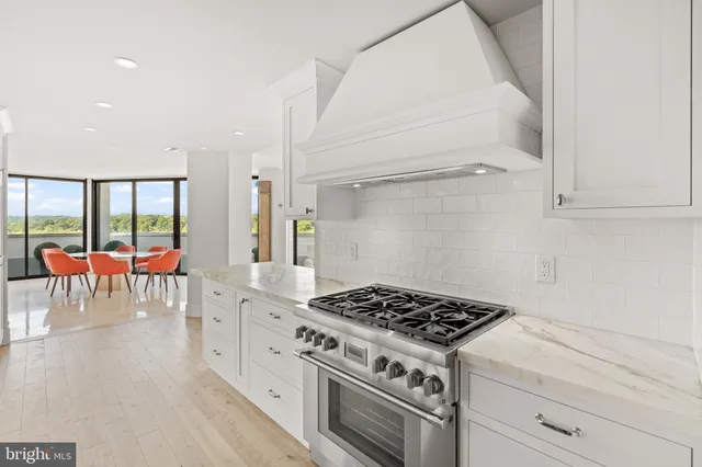 a spacious bedroom with a bed and a large window