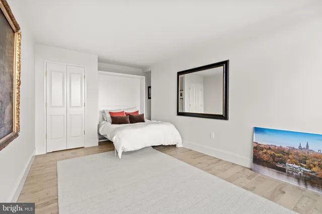 a view of a big room with windows and plants