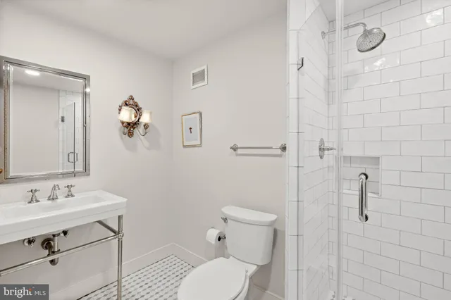 a dining room with furniture and a chandelier