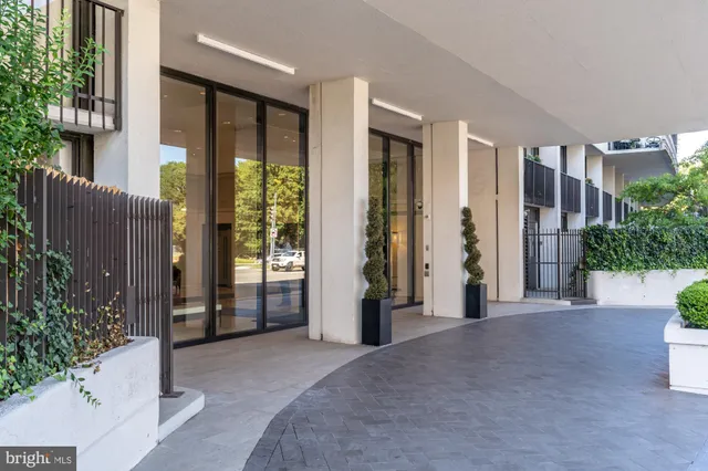 a view of a swimming pool with sitting area