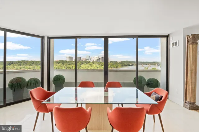 a view of a dining room with furniture window and outside view