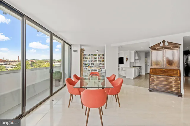 a view of a dining room with furniture window and outside view