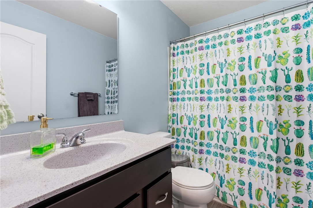 141 Old Pond Road Springboro, OH 45066 - Photo 14 of 20 This bright bathroom features a modern vanity and a playful shower curtain.