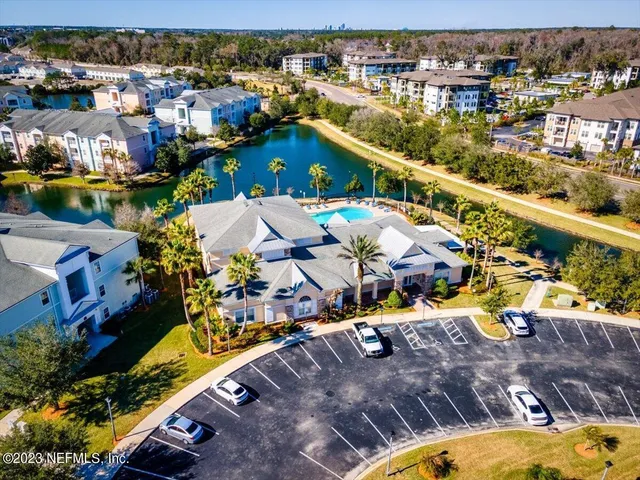 an aerial view of a house with a swimming pool yard and outdoor seating
