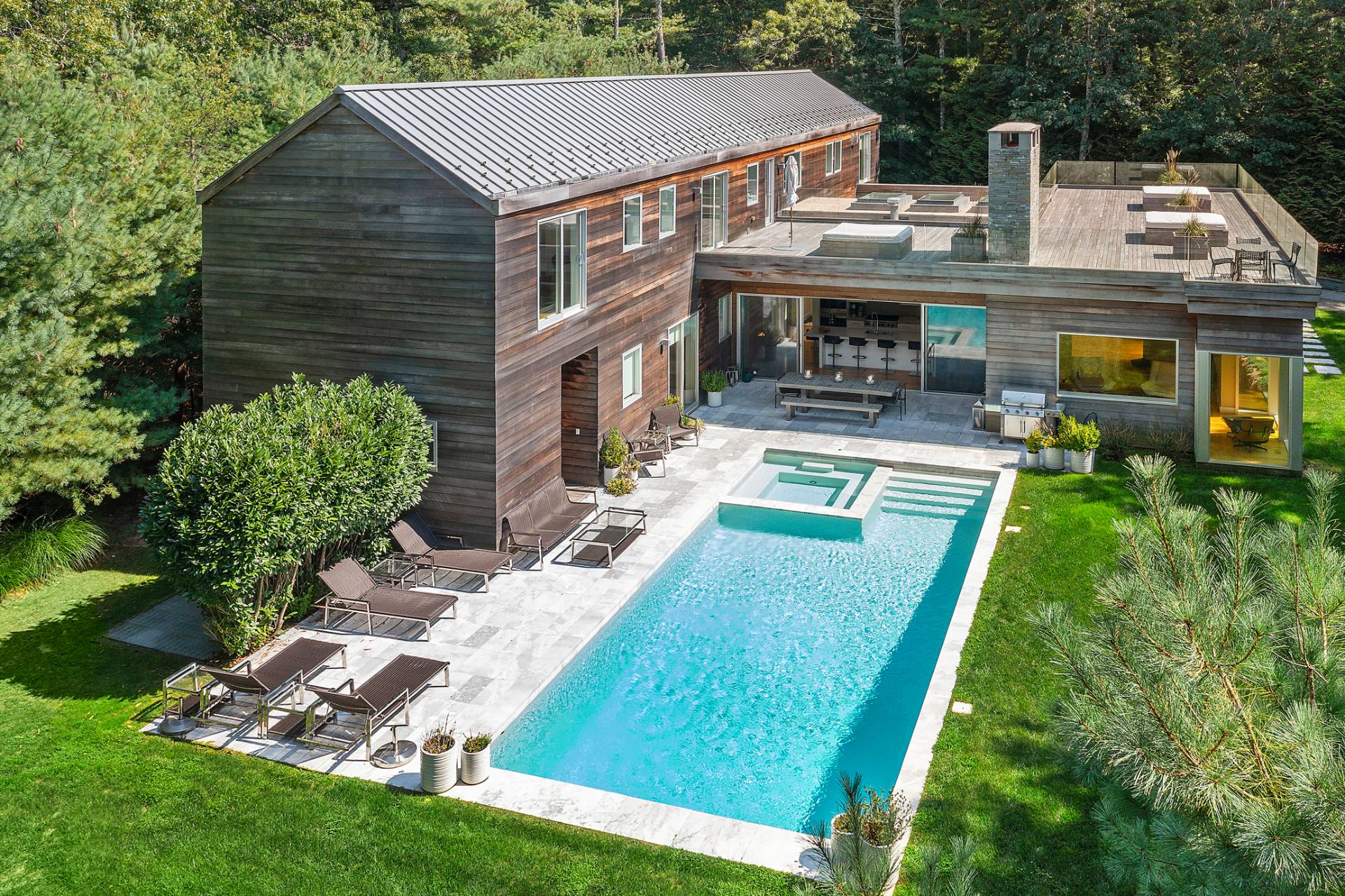 a aerial view of a house with swimming pool