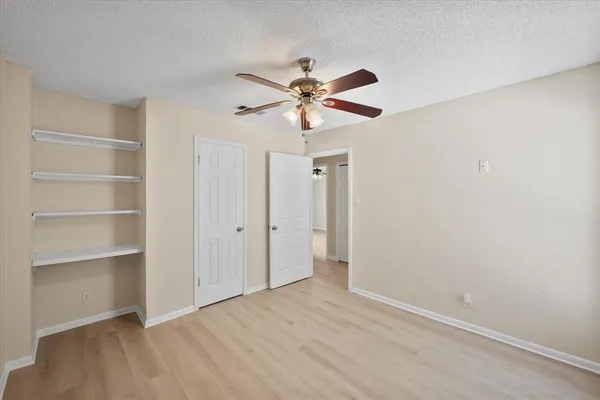 a view of a chandelier fan in a room