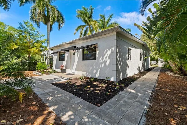 a front view of a house with garden