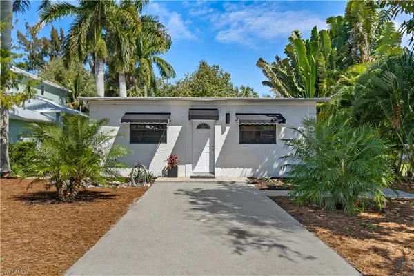 front view of a house with a garden