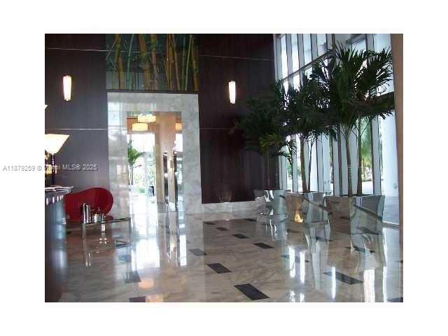 185 Southwest 7th Street, Unit 1909 Miami, FL 33130 - Photo 6 of 6 a dining room with table and chairs