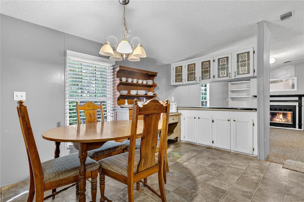 42312 Webster Street Altoona, FL 32702 - Photo 7 of 30 a view of a dining room with furniture and wooden floor