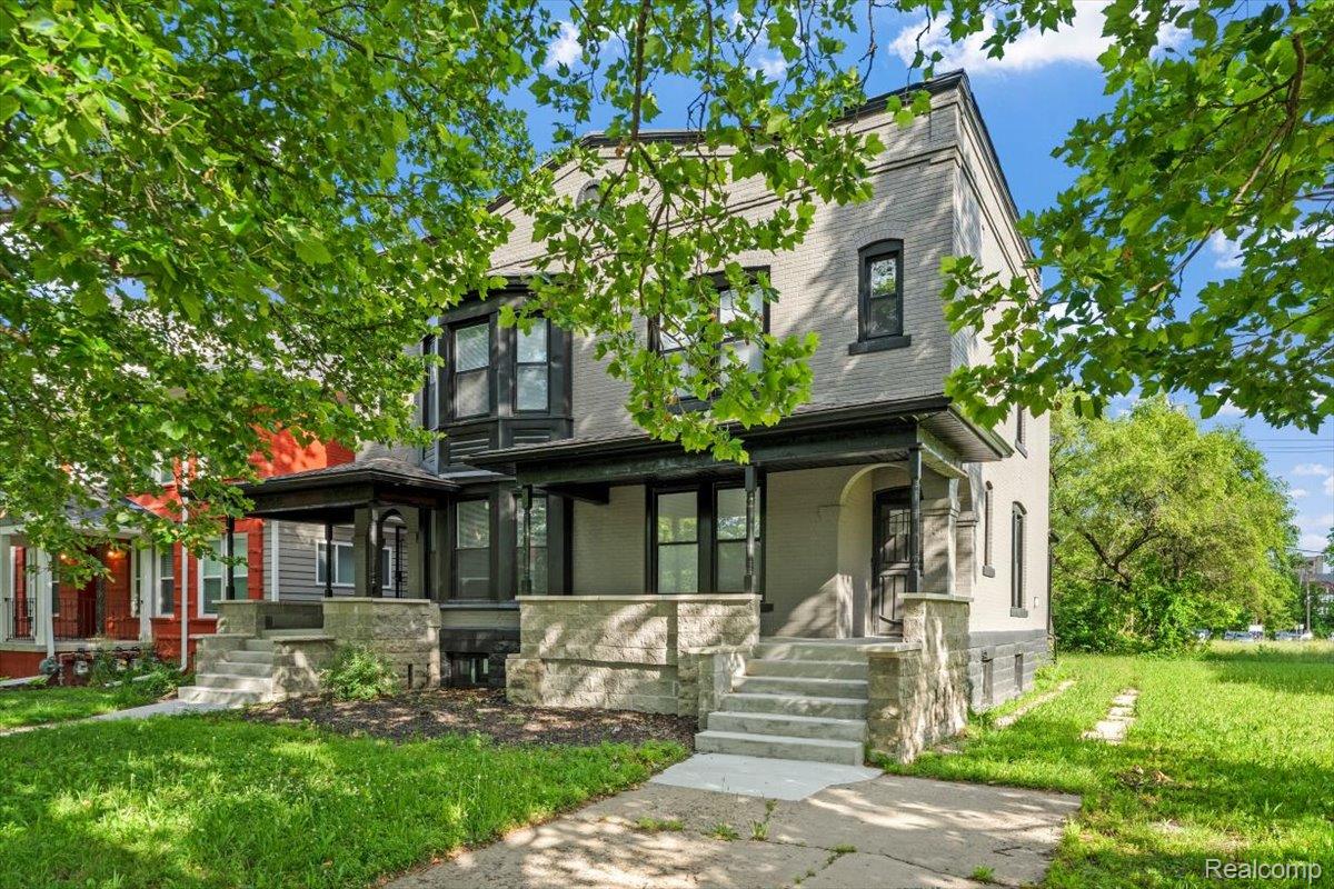 58 East Philadelphia Street Detroit, MI 48202 - Photo 3 of 24 Multi-unit residence featuring a light-colored brick facade with dark trim accents