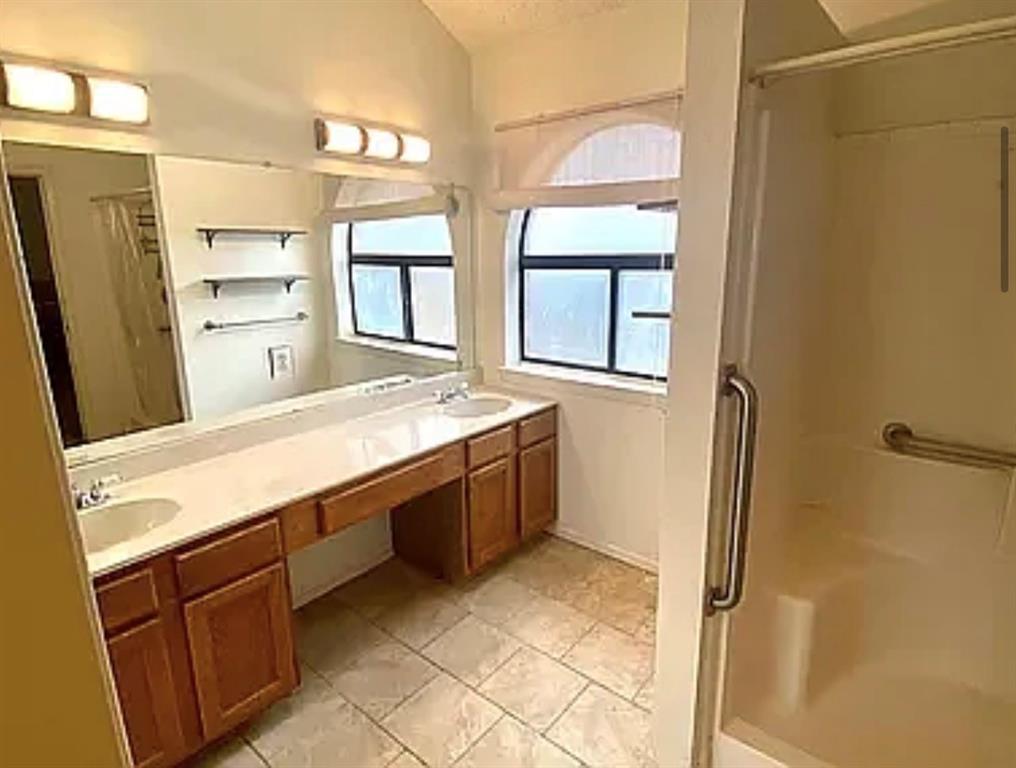 2614 Timberview Circle Corinth, TX 76210 - Photo 14 of 18 a room with stainless steel appliances cabinets and wooden floor