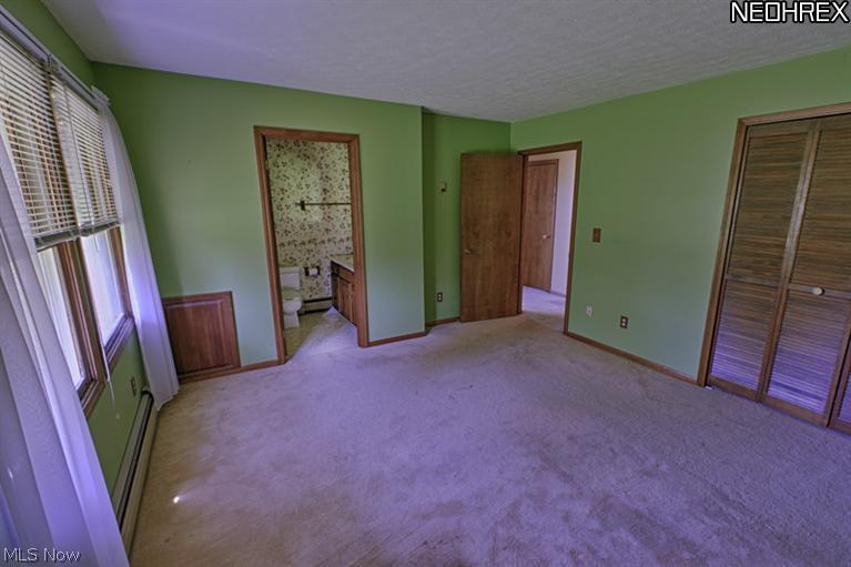 5509 River Road Madison, OH 44057 - Photo 24 of 25 Front bedroom that leads to private full bathroom