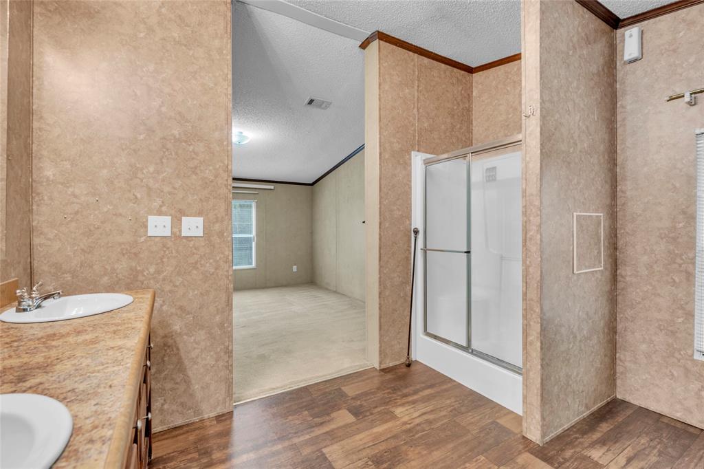 1448 Boys Ranch Road Waco, TX 76705 - Photo 11 of 31 a bathroom with a sink and a mirror