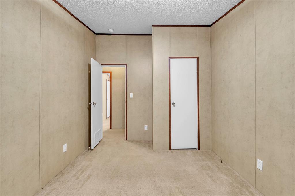 1448 Boys Ranch Road Waco, TX 76705 - Photo 13 of 31 an empty room with windows and closet