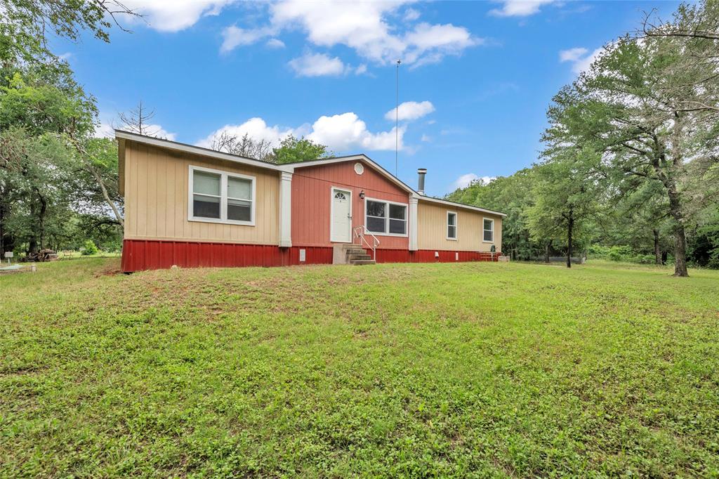 1448 Boys Ranch Road Waco, TX 76705 - Photo 2 of 31 a front view of house with yard and green space