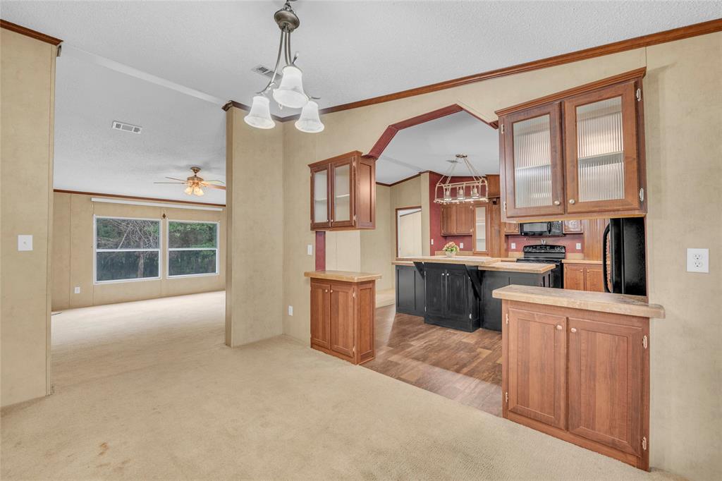 1448 Boys Ranch Road Waco, TX 76705 - Photo 23 of 31 a large kitchen with cabinets and stainless steel appliances