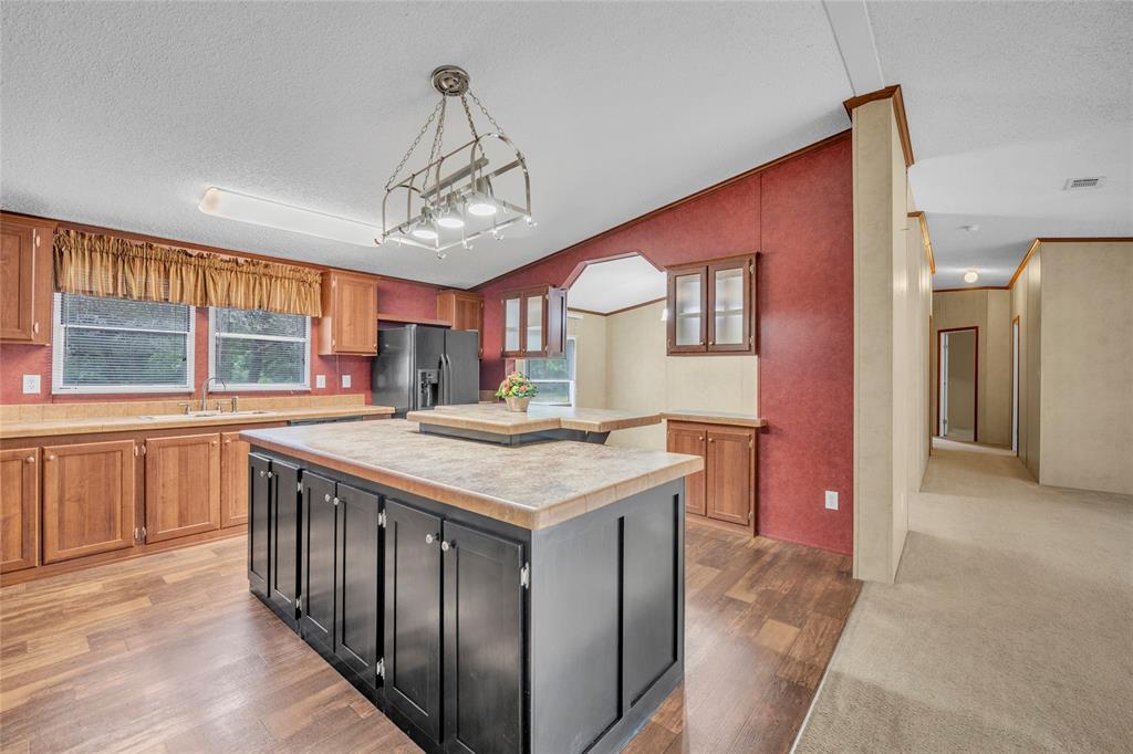 1448 Boys Ranch Road Waco, TX 76705 - Photo 24 of 31 a kitchen that has a lot of cabinets in it
