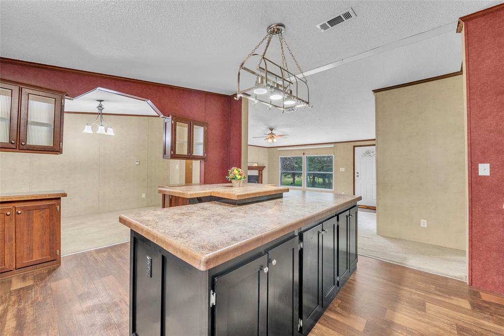 1448 Boys Ranch Road Waco, TX 76705 - Photo 25 of 31 a kitchen with a table and chairs in it