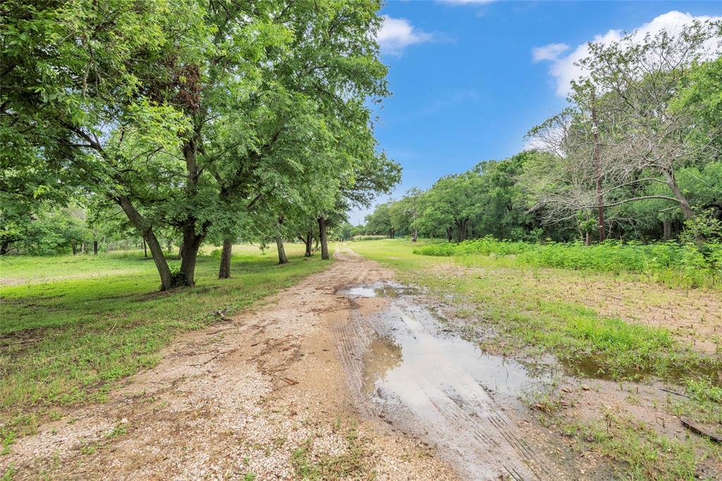 1448 Boys Ranch Road Waco, TX 76705 - Photo 31 of 31 a view of a road with a yard