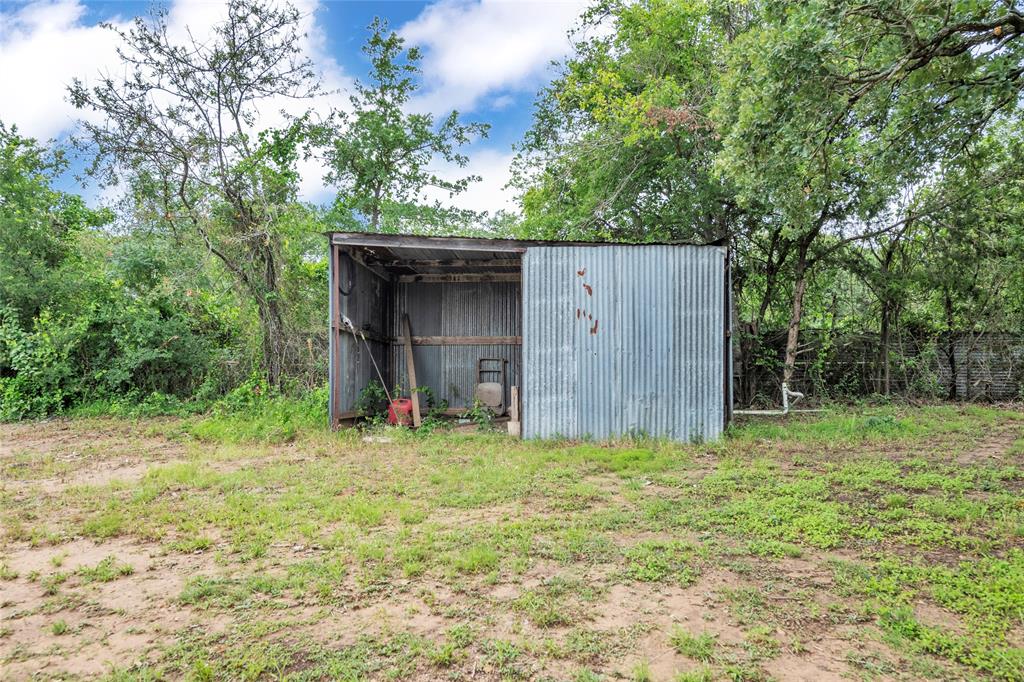 1448 Boys Ranch Road Waco, TX 76705 - Photo 6 of 31 a house with trees in the background