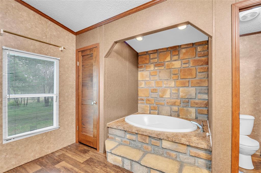 1448 Boys Ranch Road Waco, TX 76705 - Photo 10 of 31 a bathroom with a sink and a mirror