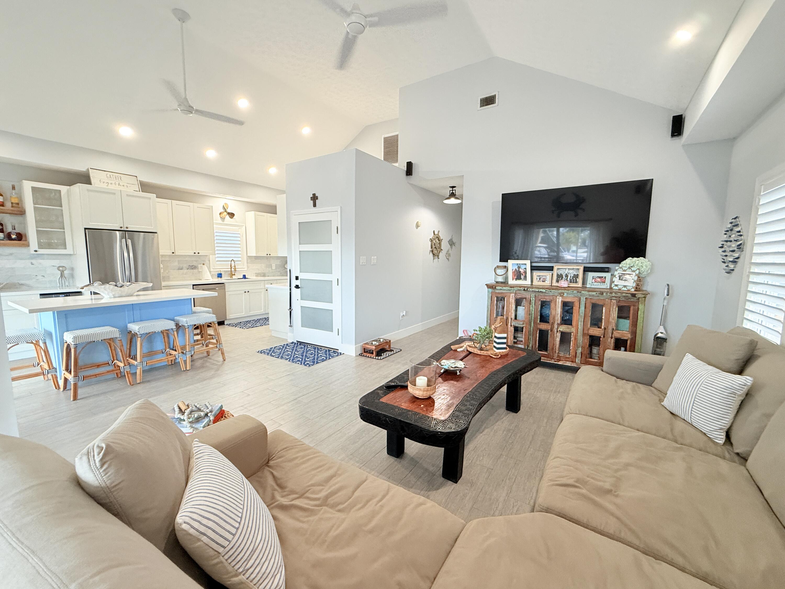 614 R Santa Anita Lane Key Largo, FL 33037 - Photo 18 of 64 a living room with furniture and a flat screen tv