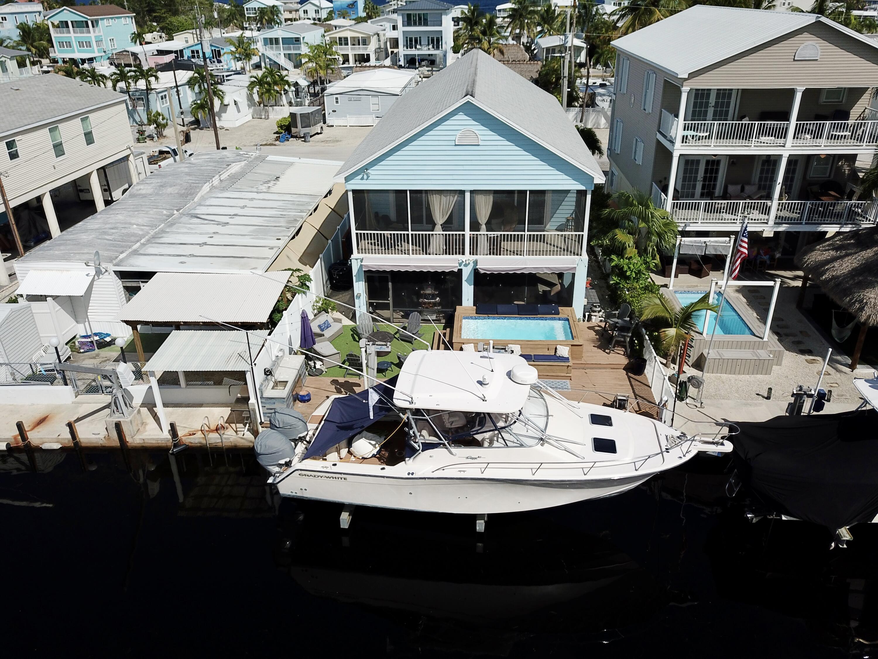 614 R Santa Anita Lane Key Largo, FL 33037 - Photo 2 of 64 a aerial view of a house with sitting area