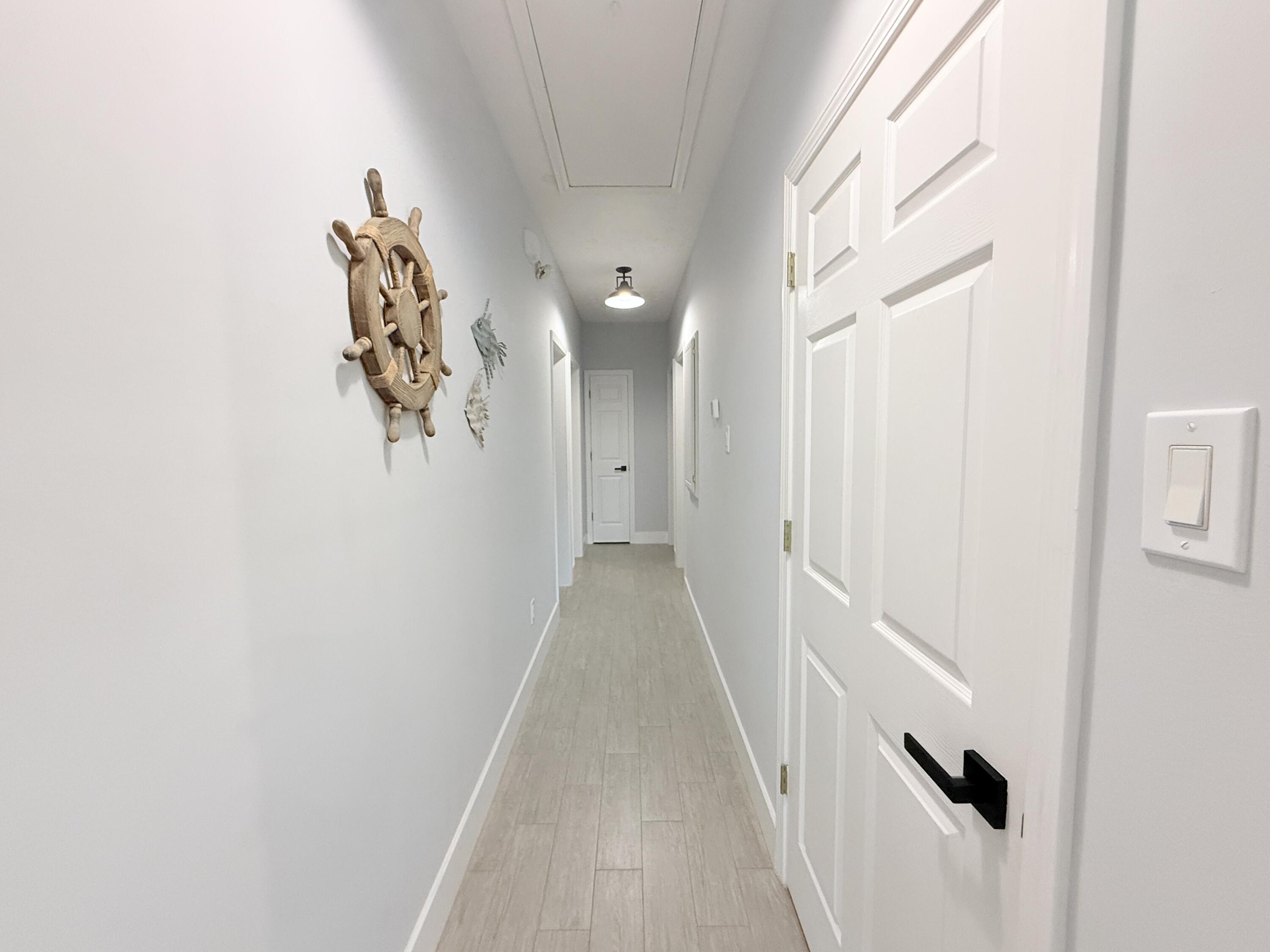 614 R Santa Anita Lane Key Largo, FL 33037 - Photo 22 of 64 a view of a hallway with a white walls